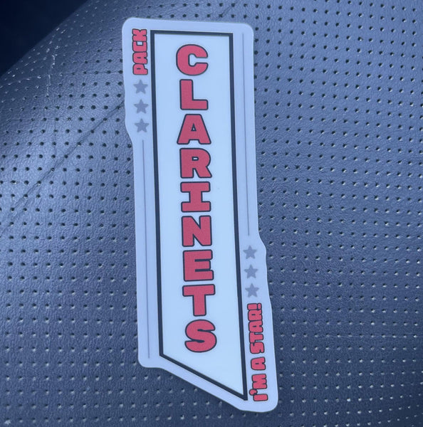 Sticker with 'Clarinets' text on a textured surface