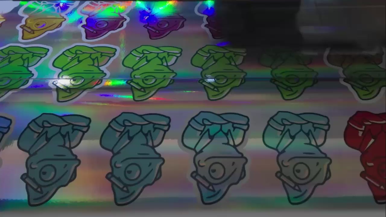 Load video: Stickers being printed, laminated, and cut out